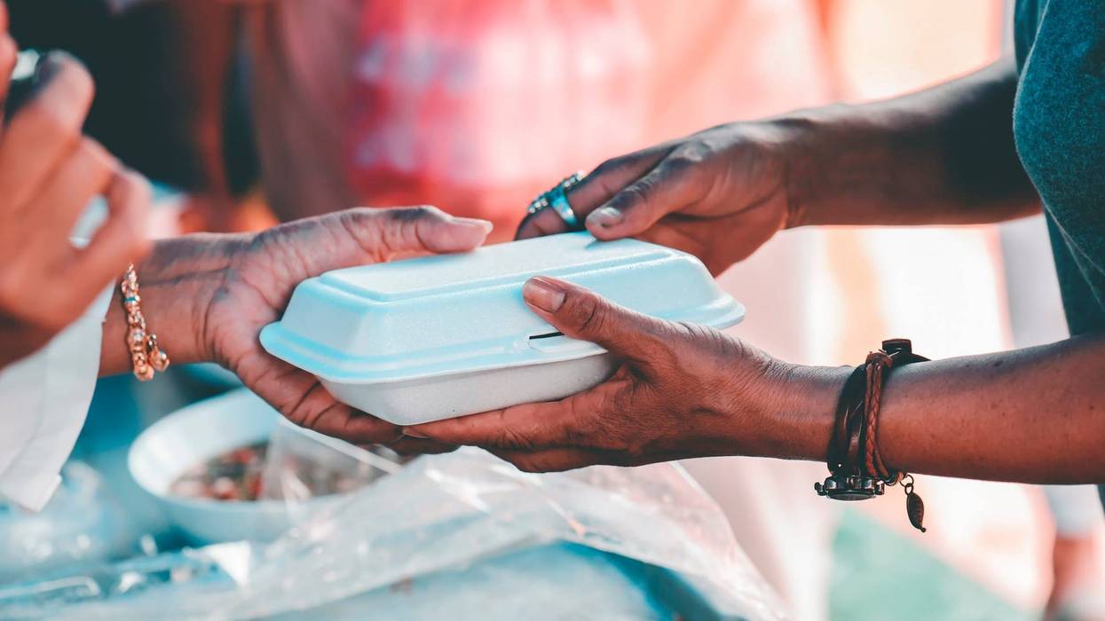 Feeding homeless people.