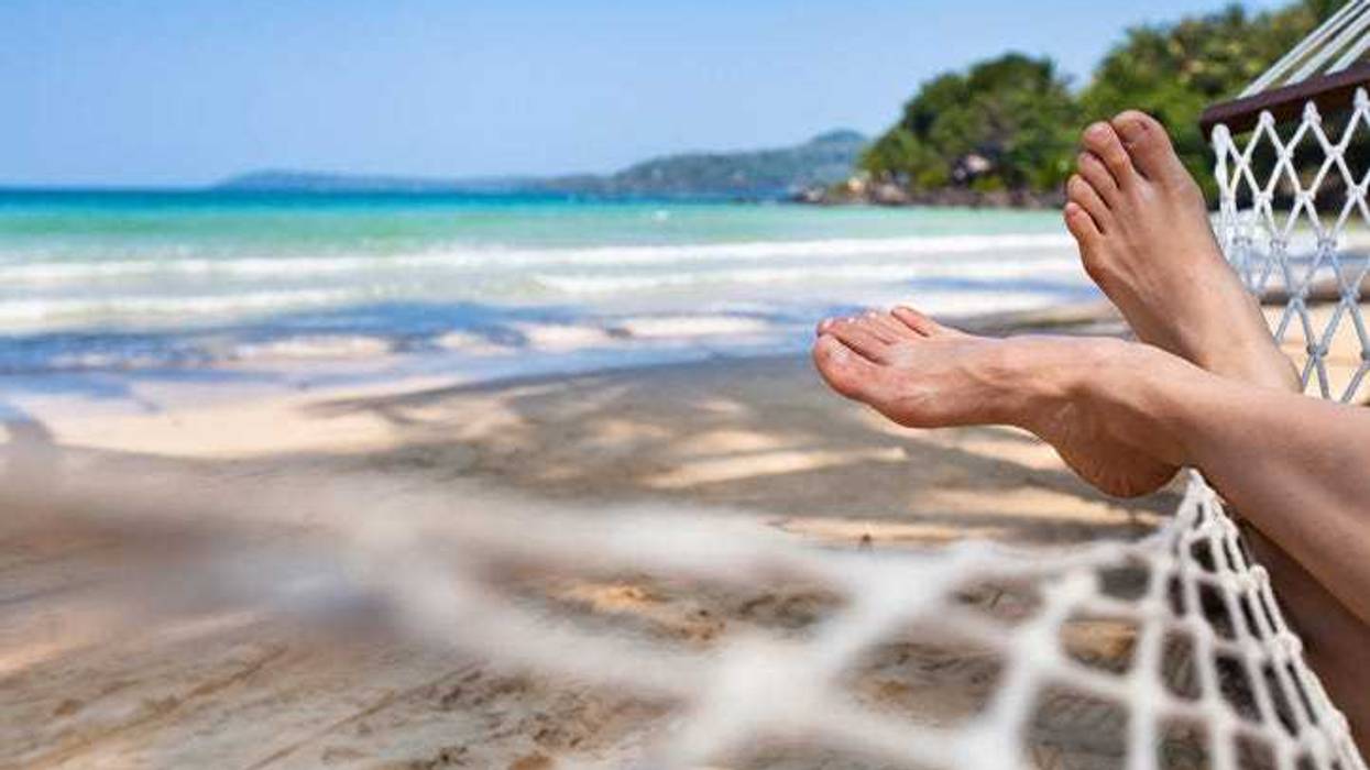 feet in a hammock on the beach