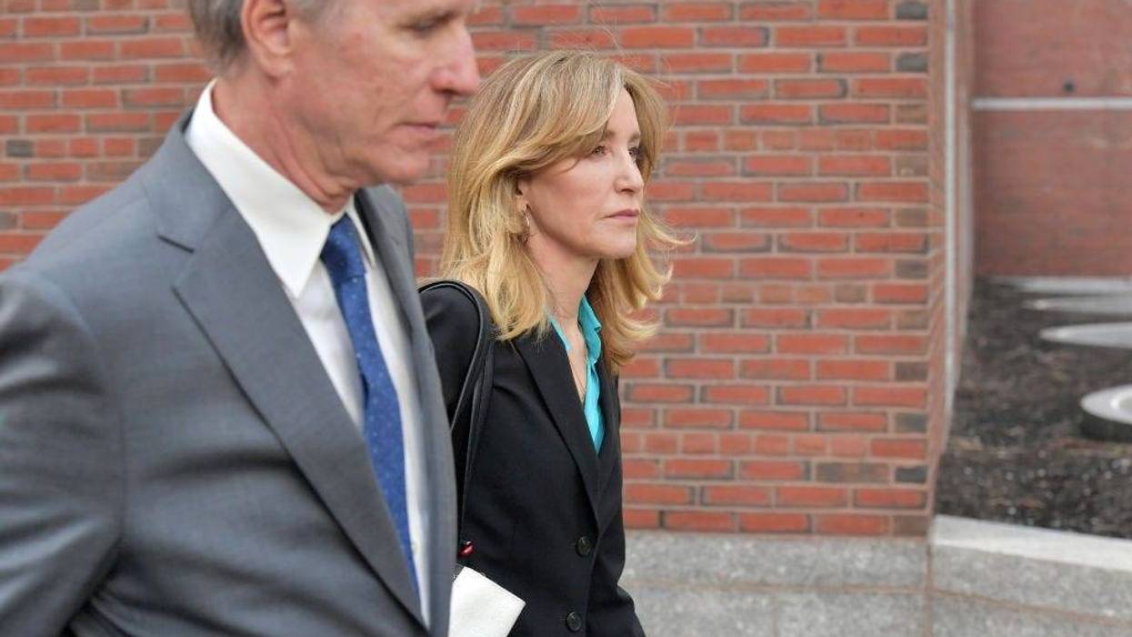 Felicity Huffman exits the John Joseph Moakley U.S. Courthouse after appearing in Federal Court to answer charges stemming from college admissions scandal on April 3, 2019 in Boston, Massachusetts