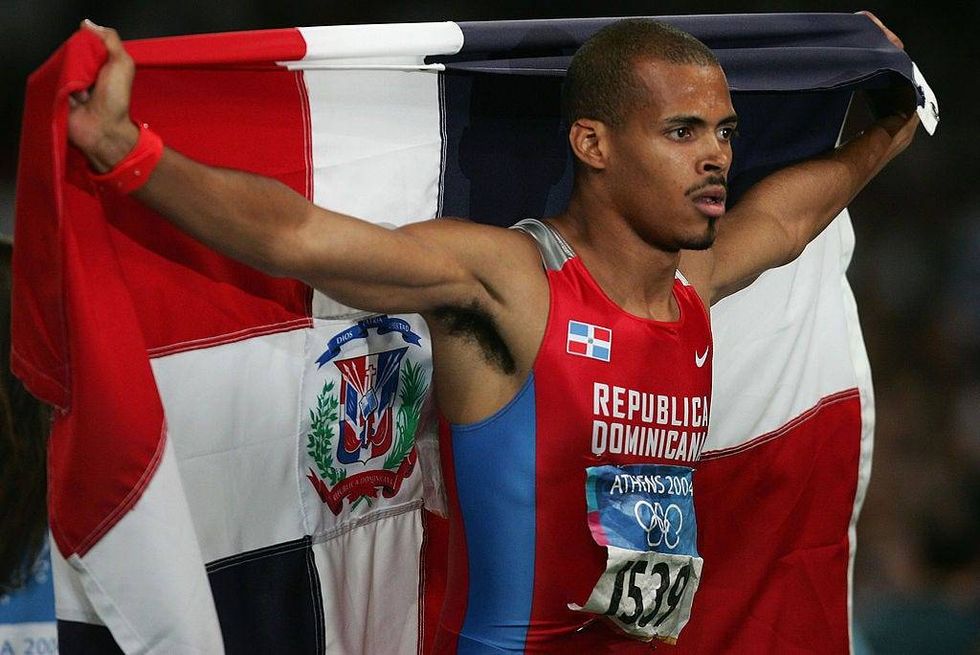 Felix Sanchez of the Dominican Republic celebrates after he won gold the men