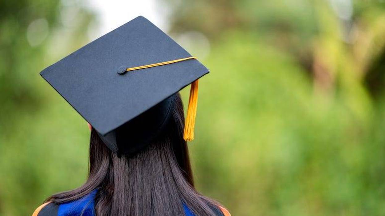 Female graduate wearing cap and gown