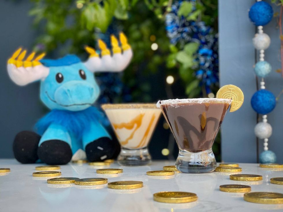 Festive cocktails with traditional Hanukkah flavors will be available for $12 each like the Festival of Lights Martini (RumChata, Bushmills Red Bush Irish Whiskey, crème de cacao white, caramel swirl, gold sugar rim) and Gelt Martini (Schmerling