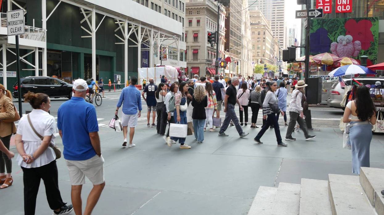Fifth 5 avenue, Manhattan Midtown street. People pedestrians on sidewalk pavement. New York City USA