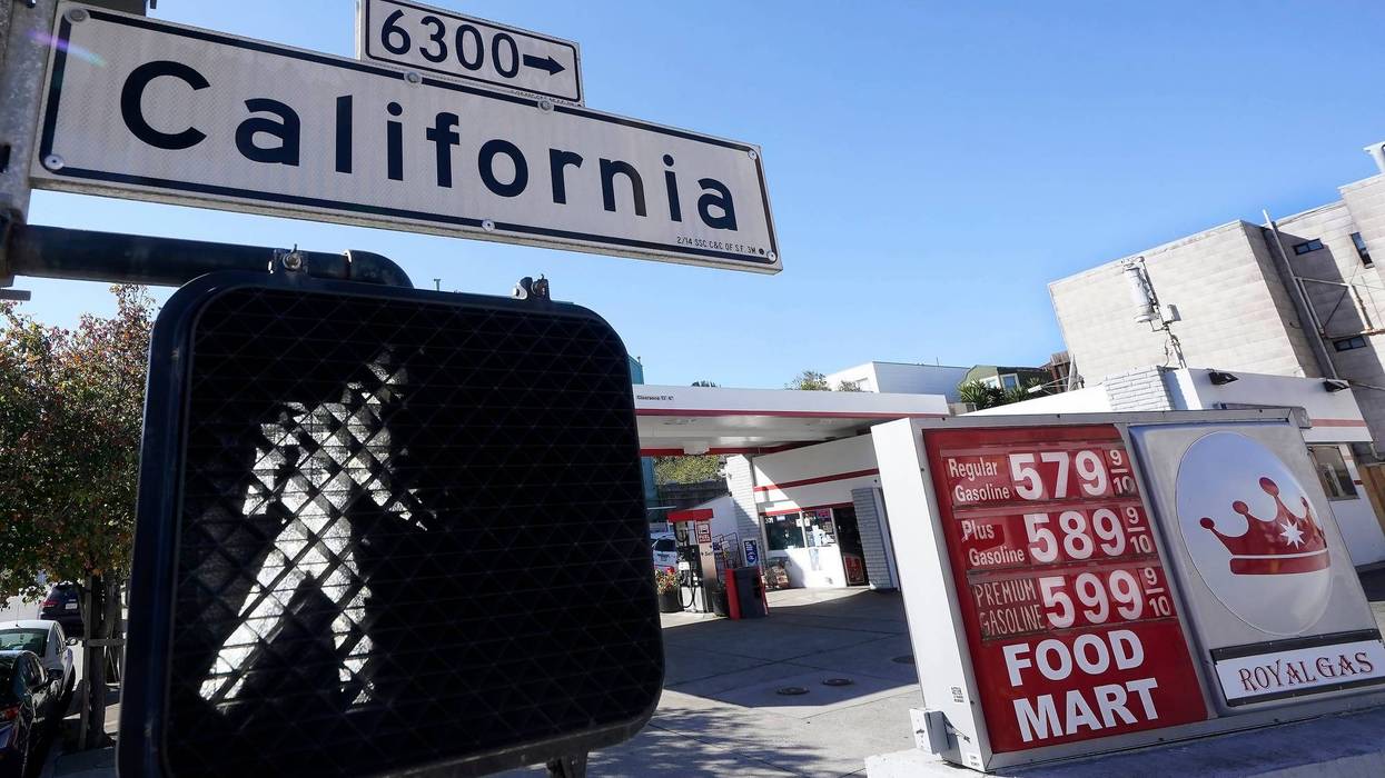 FILE - A California street sign is shown next to the price board at a gas station in San Francisco, on March 7, 2022. The average U.S. price of regular-grade gasoline shot up a whopping 79 cents over the past two weeks to $4.43 per gallon. Industry analyst Trilby Lundberg of the Lundberg Survey says Sunday, March 13, the new price exceeds by 32 cents the prior record high of $4.11 set in July 2008. Lundberg said gas prices are likely to remain high in the short term as crude oil costs soar amid global supply concerns following Russia's invasion of Ukraine. Nationwide, the highest average price for regular-grade is in the San Francisco Bay Area, at $5.79.