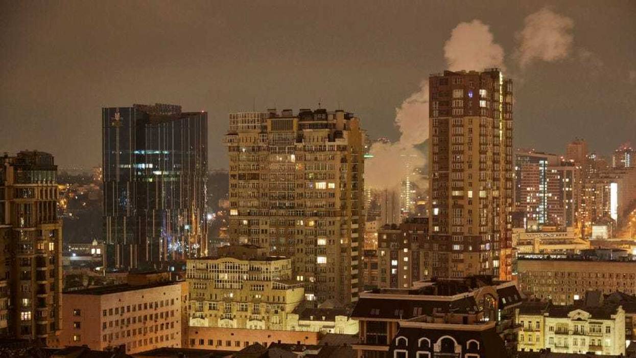 FILE - A night view of Kyiv as the Kyiv mayor declared a curfew from 10 p.m. to 7 a.m. on Feb. 24, 2022 in Kyiv, Ukraine. Overnight, Russia began a large-scale attack on Ukraine, with explosions reported in multiple cities and far outside the restive eastern regions held by Russian-backed rebels.