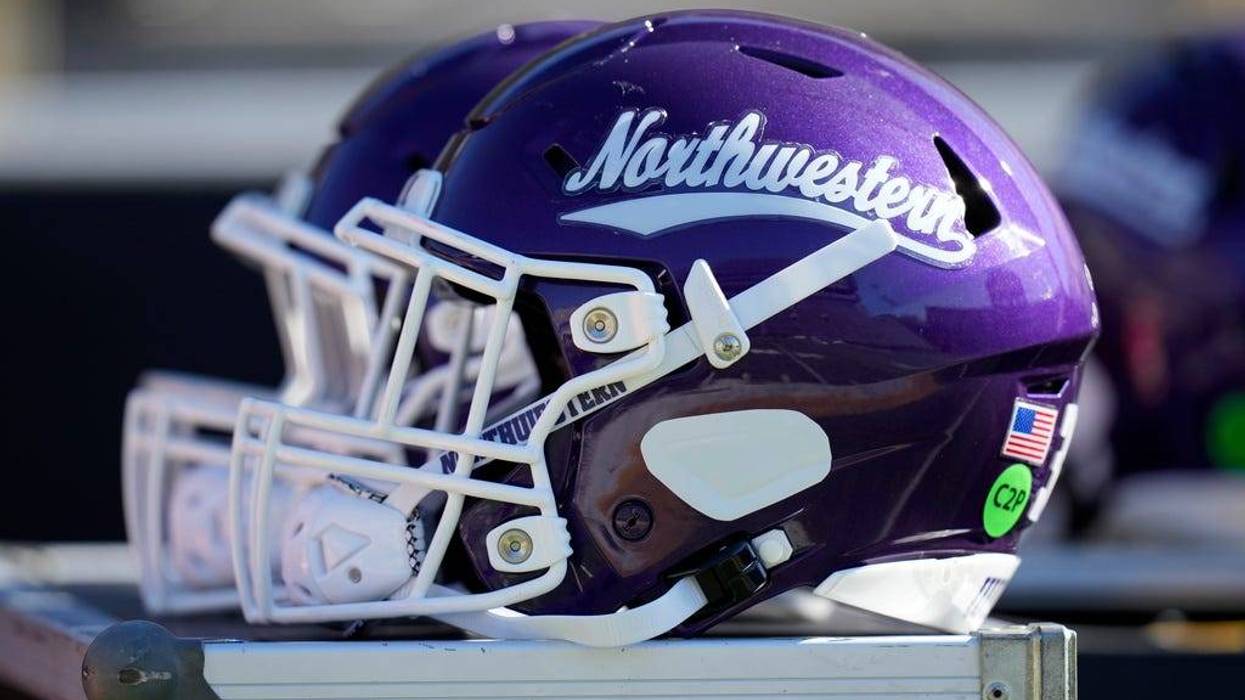 FILE - A Northwestern helmet is seen on the bench before an NCAA college football game against Iowa, Oct. 26, 2024, in Iowa City, Iowa.
