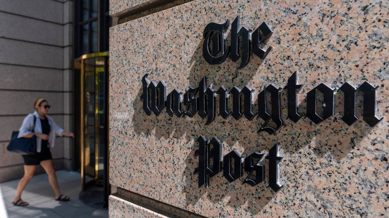 FILE - A person walks into the One Franklin Square Building, home of The Washington Post newspaper, June 21, 2024, in Washington.