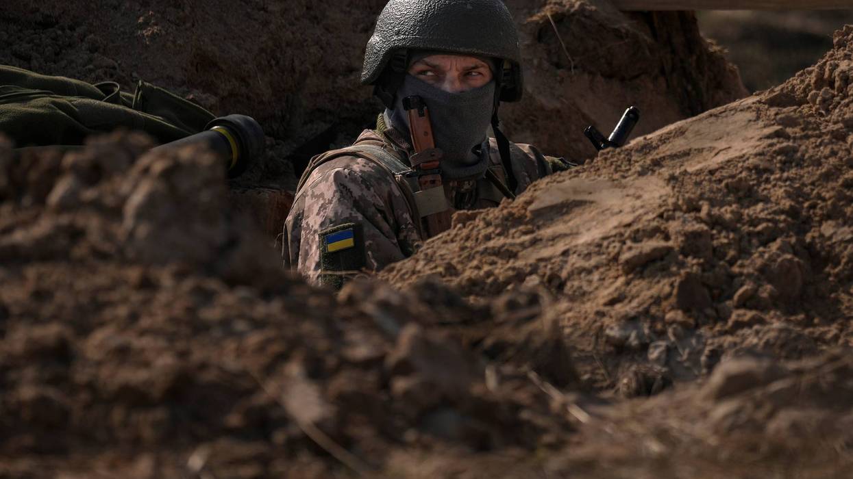 FILE - A Ukrainian serviceman stands in a trench at a position north of the capital Kyiv, Ukraine, Tuesday, March 29, 2022. The first face-to-face talks in two weeks between Russia and Ukraine began Tuesday in Turkey, raising flickering hopes there could be progress toward ending a war that has ground into a bloody campaign of attrition.