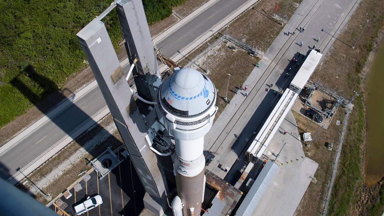 FILE - A United Launch Alliance Atlas V rocket with Boeing's CST-100 Starliner spacecraft is rolled out of the Vertical Integration Facility, May 18, 2022 at Cape Canaveral Space Force Station in Florida. Boeing’s first Starliner flight with astronauts aboard has been delayed until at least next March.