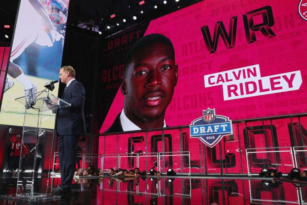 FILE - A video board displays an image of Calvin Ridley of Alabama after he was picked #26 overall by the Atlanta Falcons during the first round of the 2018 NFL Draft at AT&T Stadium on April 26, 2018 in Arlington, Texas.
