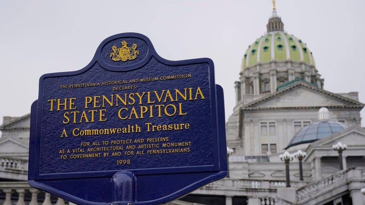 FILE - An historical marker at the Pennsylvania Capitol in Harrisburg, Pa., is seen on Feb. 21, 2023. Authorities could temporarily seize firearms and background checks would be expanded for gun buyers, under two bills passed Monday, May 22, 2023, in the Pennsylvania House, where Democrats are using their razor-thin majority to push gun-control measures after a yearslong standstill in the politically divided government. (AP Photo/Matt Rourke, File)