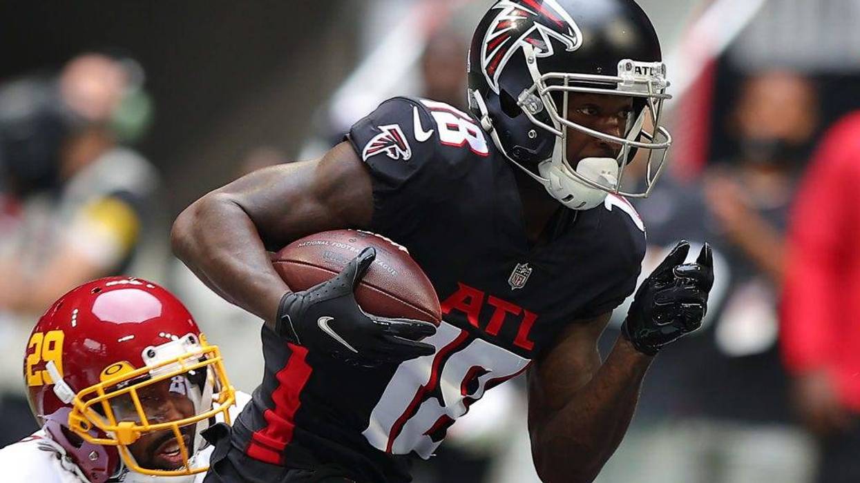 FILE - Calvin Ridley #18 of the Atlanta Falcons runs with the ball after the catch against Kendall Fuller #29 of the Washington Football Team in the first quarter at Mercedes-Benz Stadium on October 03, 2021 in Atlanta, Georgia.
