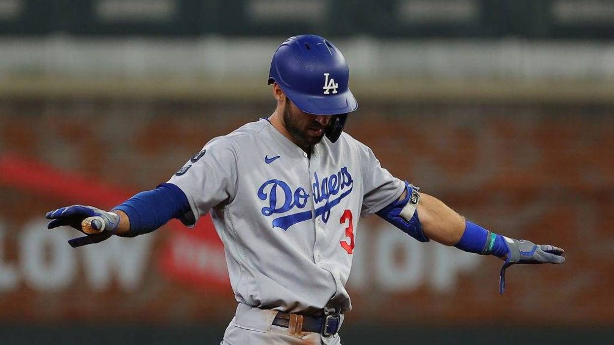 FILE - Chris Taylor #3 of the Los Angeles Dodgers reacts to a double during the seventh inning of Game Six of the National League Championship Series against the Atlanta Braves at Truist Park on October 23, 2021 in Atlanta, Georgia.