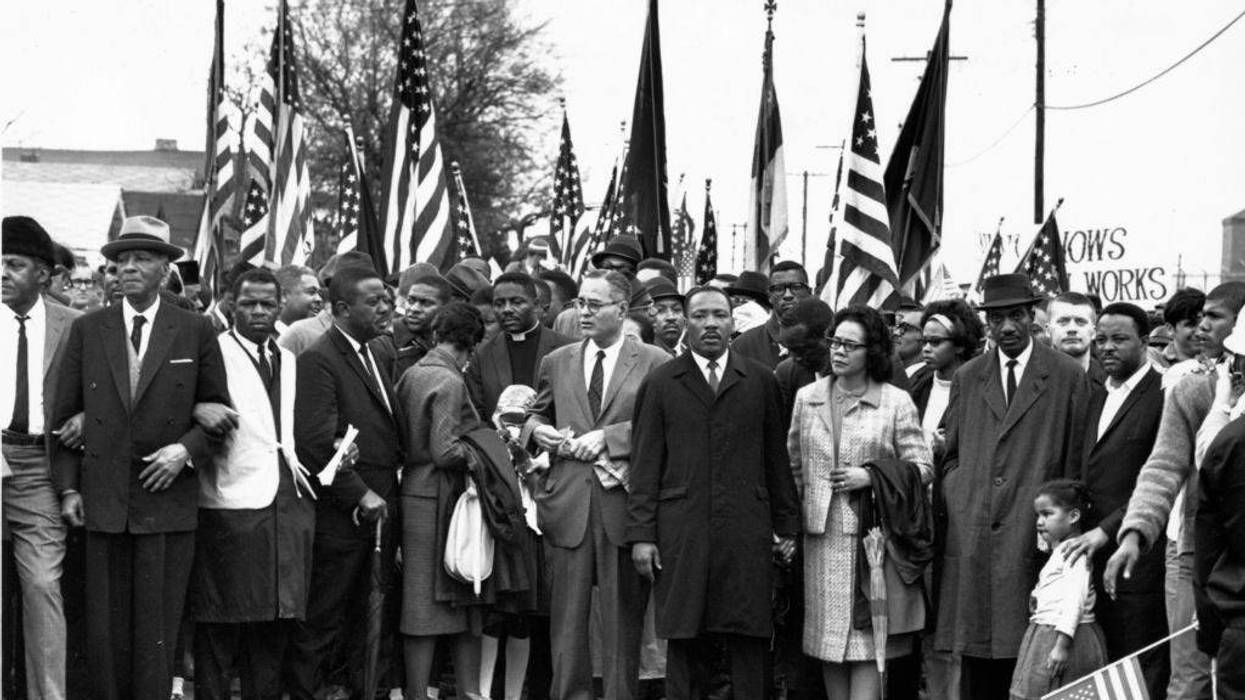 FILE - Civil rights campaigner Dr Martin Luther King (pictured center, right) with his wife Coretta Scott King at a black voting rights march from Selma, Alabama, to the state capital in Montgomery in March 1965. Among the group are civil rights activists Bayard Rustin, John Lewis, Reverend Ralph Abernathy, Ralph Bunche, and Hosea Williams.