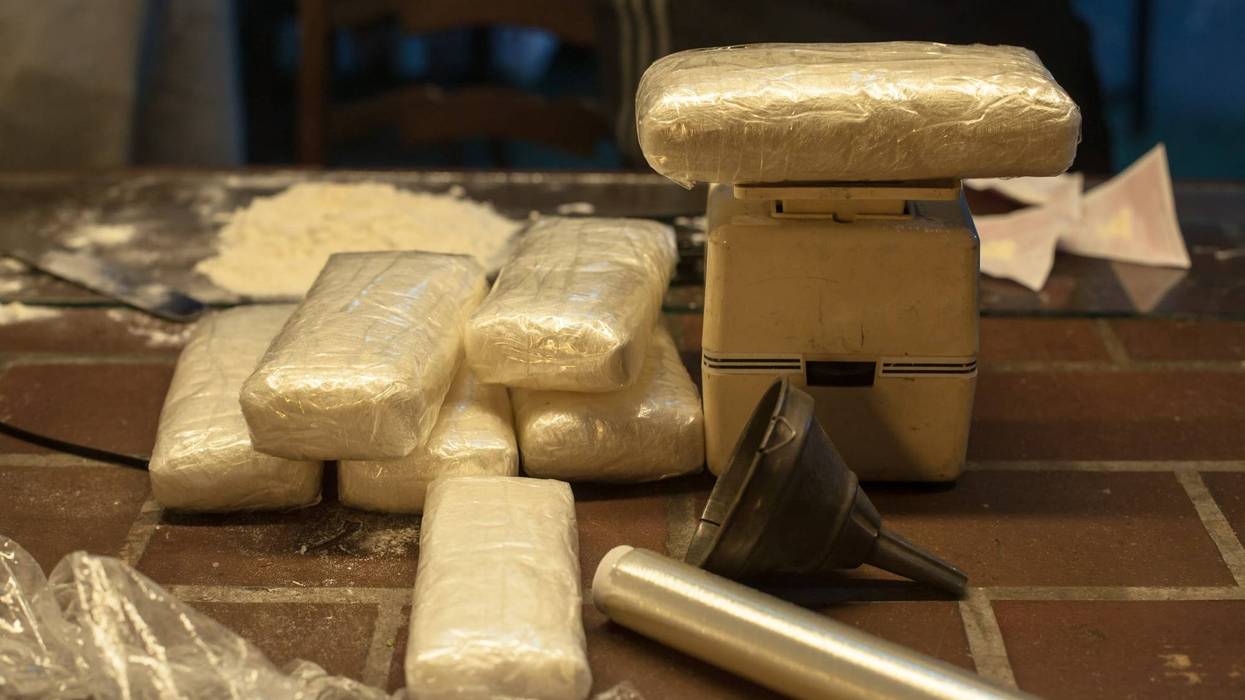 FILE: Cocaine weighed into kilogram packets.