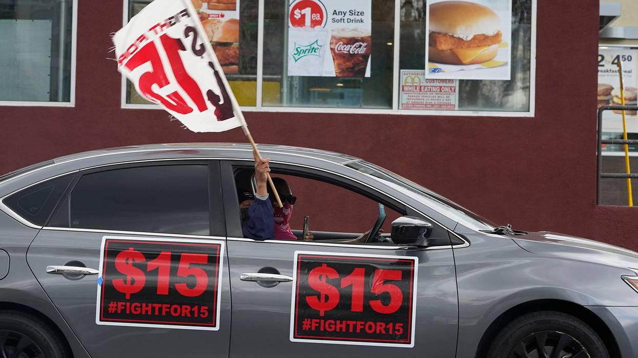 FILE - Fast-food workers drive though a McDonald's restaurant demanding a $15 hourly minimum wage in East Los Angeles, Friday, March 12, 2021. California lawmakers adjourned this year's legislative session, Wednesday Aug. 31, 2022, leaving Gov. Gavin Newsom with 30 days to sign or reject hundreds of bills including a bill to give a half-million fast food workers more power, protections and wages.