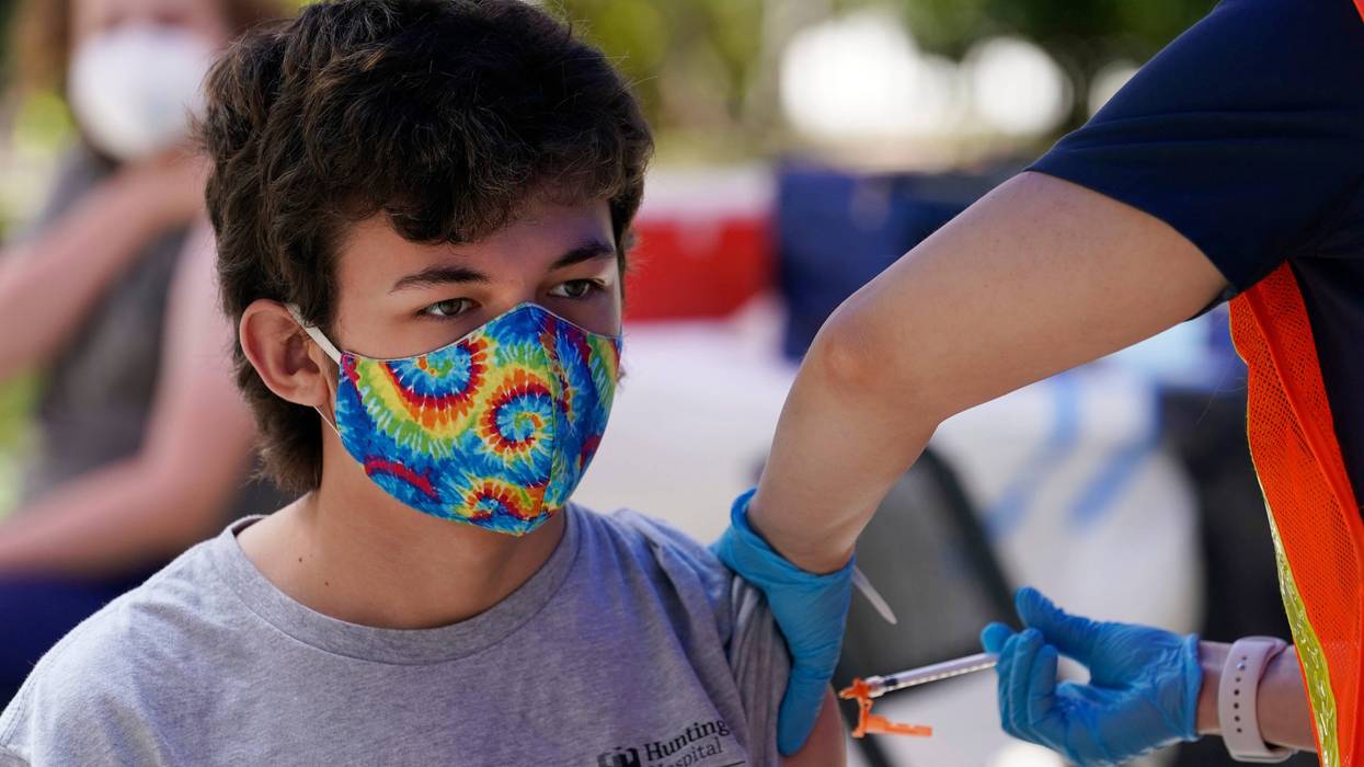 FILE — Finley Martin, 14, gets a shot of the Pfizer COVID-19 vaccine at the First Baptist Church of Pasadena, May 14, 2021, in Pasadena, Calif. A bill that would have allowed teens age 15 and up to get the coronavirus vaccine without parental consent will not pass the Legislature, state Sen. Scott Wiener announced, Wednesday, Aug. 31, 2022. Wiener, the bill's author, said it didn't have enough support to clear the state Assembly.