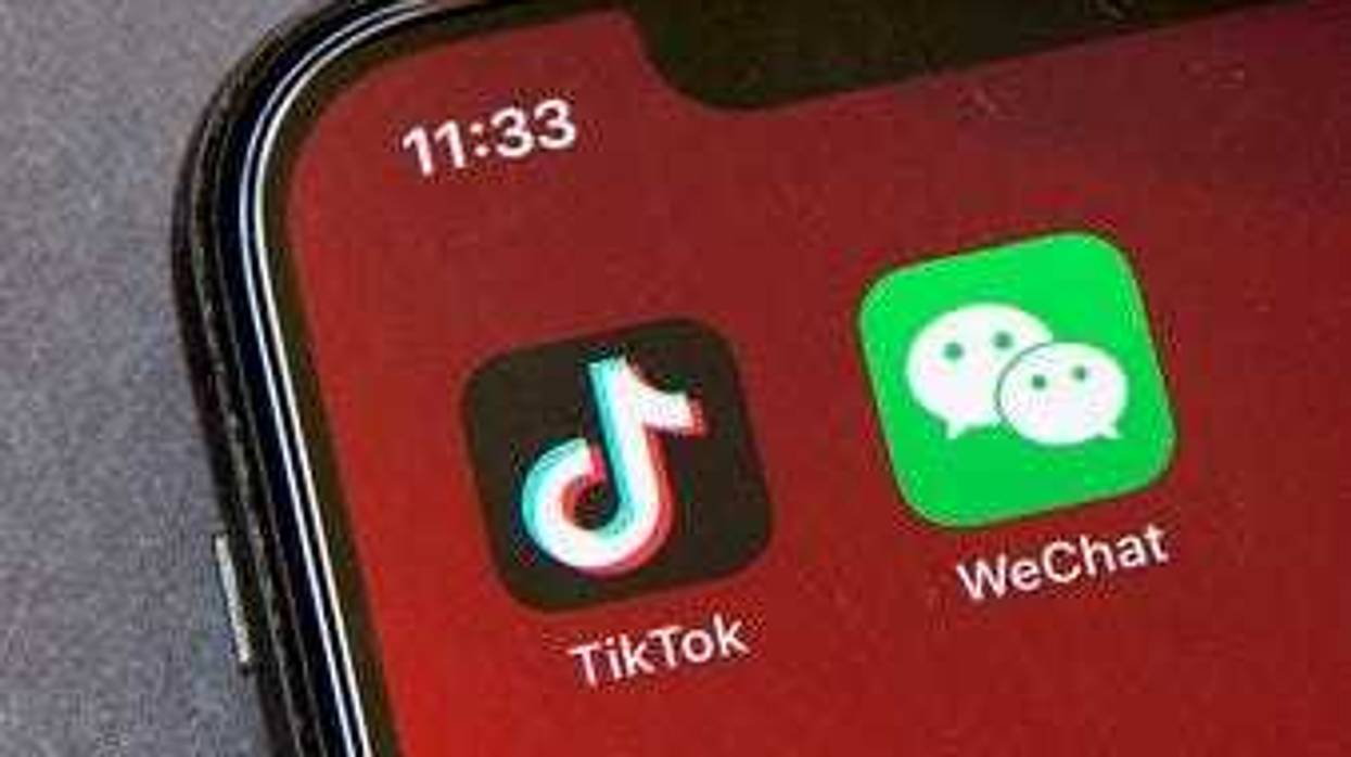 FILE - Icons for the smartphone apps TikTok and WeChat are seen on a smartphone screen in Beijing, in a Friday, Aug. 7, 2020 file photo. (AP Photo/Mark Schiefelbein, File)