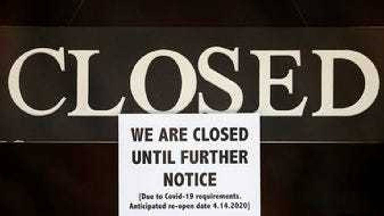 FILE - In this April 2, 2020 file photo, a notice of closure is posted at The Great Frame Up in Grosse Pointe Woods, Mich. (AP Photo/Paul Sancya, File)