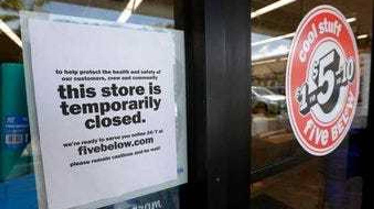FILE - In this April 23, 2020 file photo, a sign is posted on a closed store in North Miami, Fla. (AP Photo/Wilfredo Lee, File)