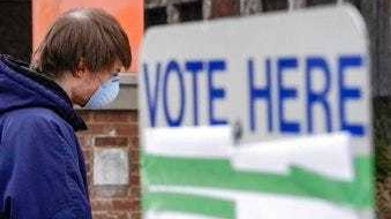 FILE - In this April 7, 2020, file photo voters line up at Riverside High School for Wisconsin's primary election in Milwaukee. (AP Photo/Morry Gash, File)