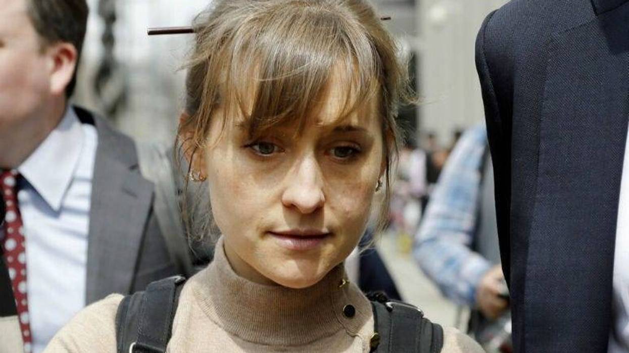 FILE- In this April 8, 2019 file photo, actress Allison Mack leaves Brooklyn federal court in New York after pleading guilty to racketeering charges in a case involving a cult-like group based in upstate New York called NXIVM.