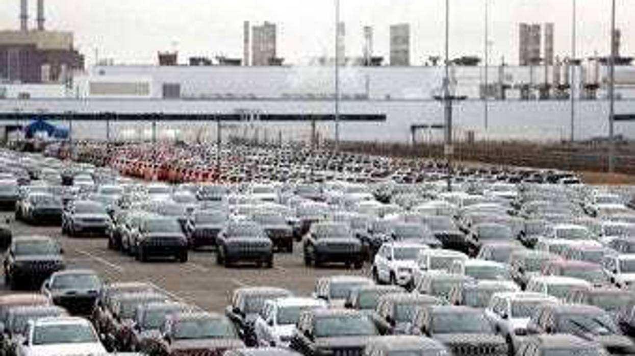 FILE - In this Feb. 26, 2019, file photo, Jeep vehicles are parked outside the Jefferson North Assembly Plant in Detroit. (AP Photo/Carlos Osorio, File)