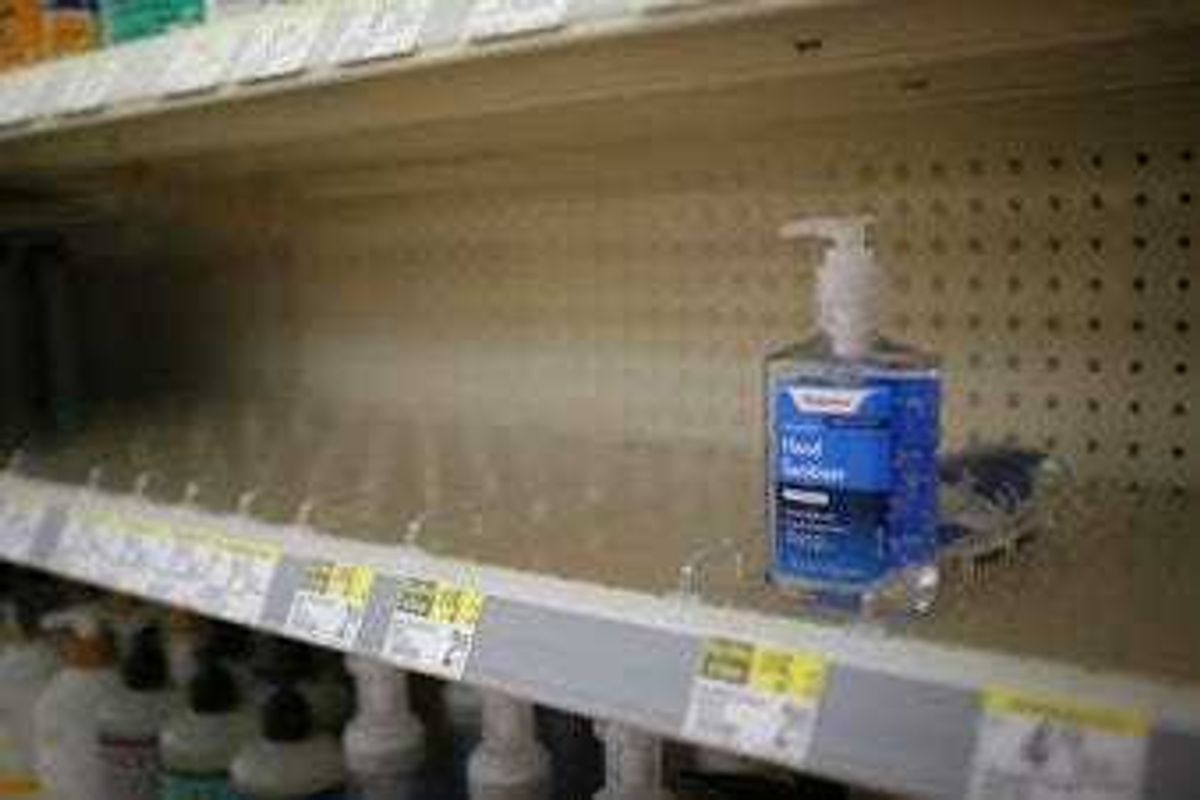 FILE - In this Feb. 28, 2020 file photo, rows of hand sanitizer are seen empty at a Walgreens in Idaho Falls, Idaho. (John Roark/The Idaho Post-Register via AP, file)