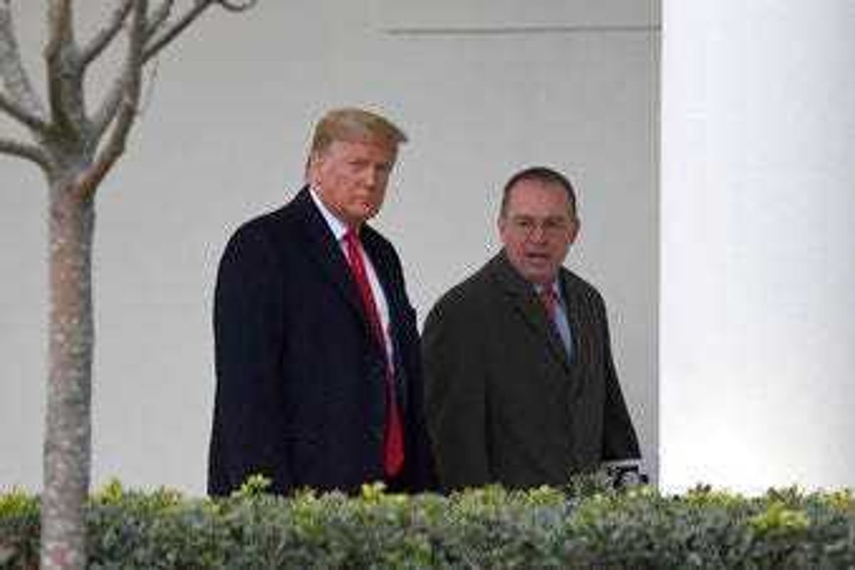 FILE - In this Jan. 13, 2020. file photo, President Donald Trump, left, and acting White House chief of staff Mick Mulvaney, right, walk along the colonnade of the White House in Washington. (AP Photo/Susan Walsh, File)