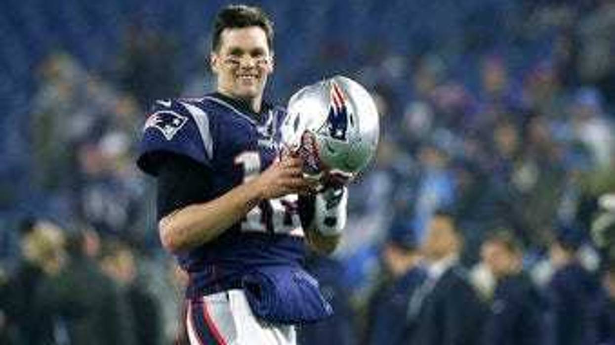 FILE - In this Jan. 4, 2020, file photo, New England Patriots quarterback Tom Brady warms up before an NFL wild-card playoff football game against the Tennessee Titans in Foxborough, Mass. (AP Photo/Elise Amendola, FIle)
