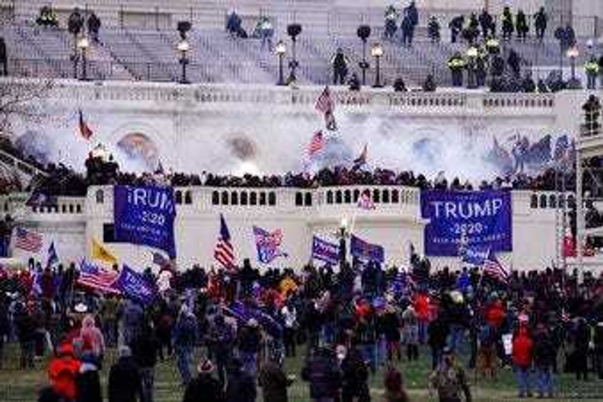 FILE - In this Jan. 6, 2021, file photo violent rioters, loyal to President Donald Trump, storm the Capitol in Washington. (AP Photo/John Minchillo, File)