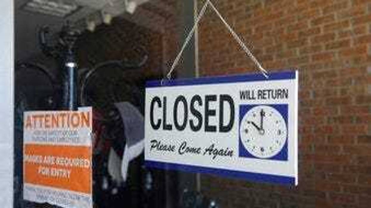 FILE - In this July 18, 2020 file photo a closed sign hangs in the window of a barber shop in Burbank, Calif. (AP Photo/Marcio Jose Sanchez, File)