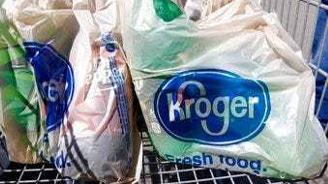 FILE - In this June 15, 2017, file photo, bagged purchases from the Kroger grocery store in Flowood, Miss., sit inside this shopping cart. (AP Photo/Rogelio V. Solis, File)