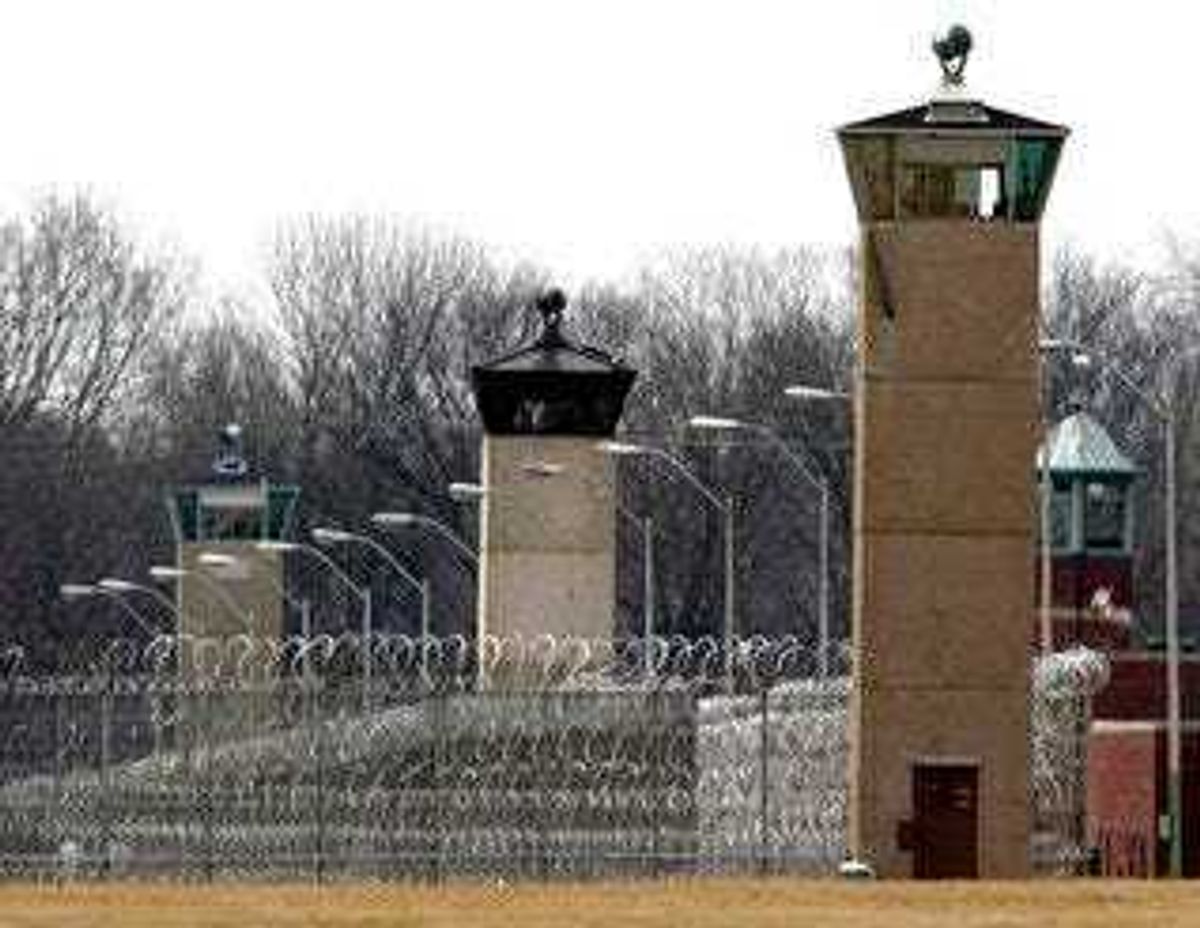 FILE - In this March 17, 2003 file photo, guard towers and razor wire ring the compound at the U.S. Penitentiary in Terre Haute, Ind., the site of the last federal execution. (AP Photo/Michael Conroy, File)