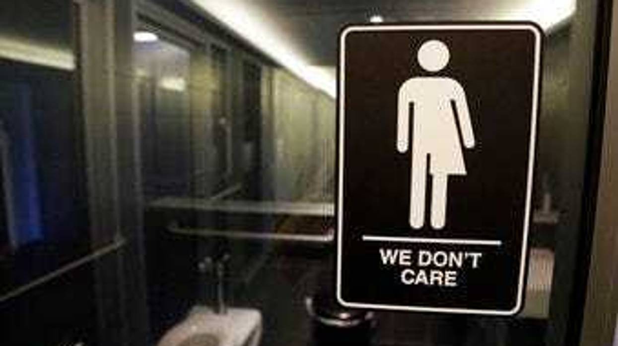 FILE - In this May 12, 2016, file photo, gender free sign hangs outside a restroom at 21c Museum Hotel in Durham, N.C. (AP Photo/Gerry Broome, File)