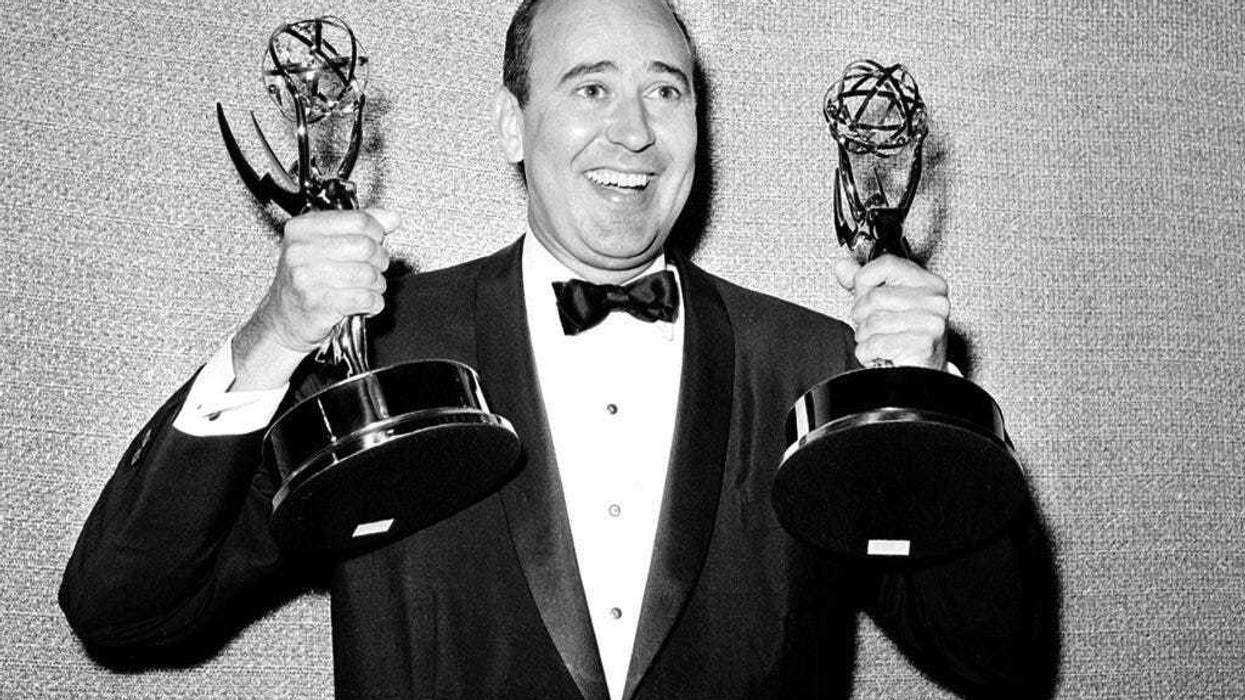 FILE - In this May 26, 1963 file photo, Carl Reiner shows holds two Emmy statuettes presented to him as best comedy writer for the "Dick Van Dyke Show," during the annual Emmy Awards presentation in Los Angeles. (AP Photo, File)
