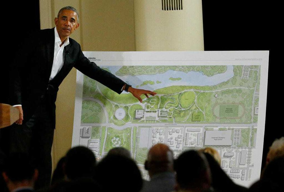 FILE - In this May 3, 2017, file photo, former President Barack Obama points to a rendering for the former president's lakefront presidential center at a community event at the South Shore Cultural Center in Chicago. Obama's presidential center will move another step closer to its brick-and-mortar future Tuesday, Sept. 28, 2021 when ground is broken.