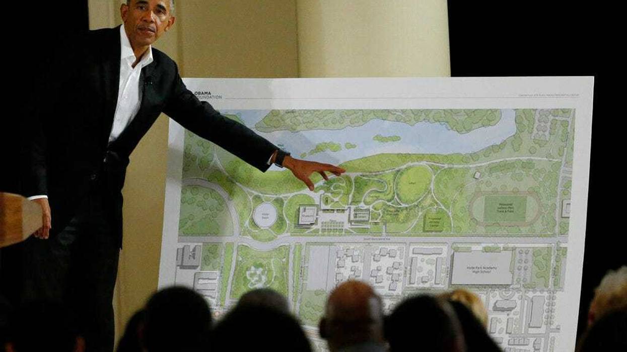 FILE - In this May 3, 2017, file photo, former President Barack Obama points to a rendering for the former president's lakefront presidential center at a community event at the South Shore Cultural Center in Chicago. Obama's presidential center will move another step closer to its brick-and-mortar future Tuesday, Sept. 28, 2021 when ground is broken.