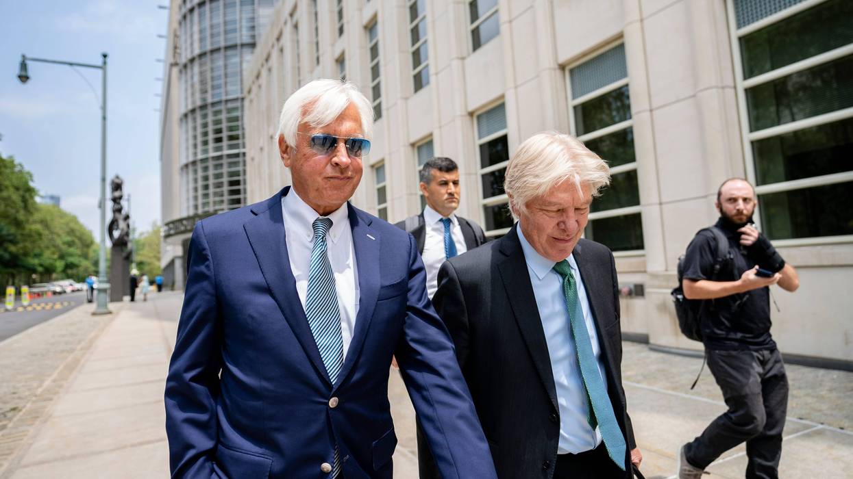 FILE - In this Monday, July 12, 2021 file photo, Horse trainer Bob Baffert, left, leaves federal court in the Brooklyn borough of New York. A New York federal judge on Wednesday, July 14, 2021 nullified the suspension of horse trainer Bob Baffert, finding that the New York Racing Association acted unconstitutionally by failing to let him adequately respond to claims made against him after Kentucky Derby winner Medina Spirit failed a postrace drug test.(AP Photo/John Minchillo, File)