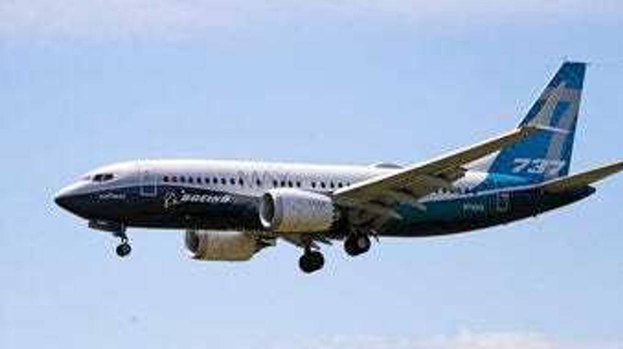 FILE - In this Monday, June 29, 2020, file photo, a Boeing 737 Max jet heads to a landing at Boeing Field following a test flight in Seattle. (AP Photo/Elaine Thompson, File)