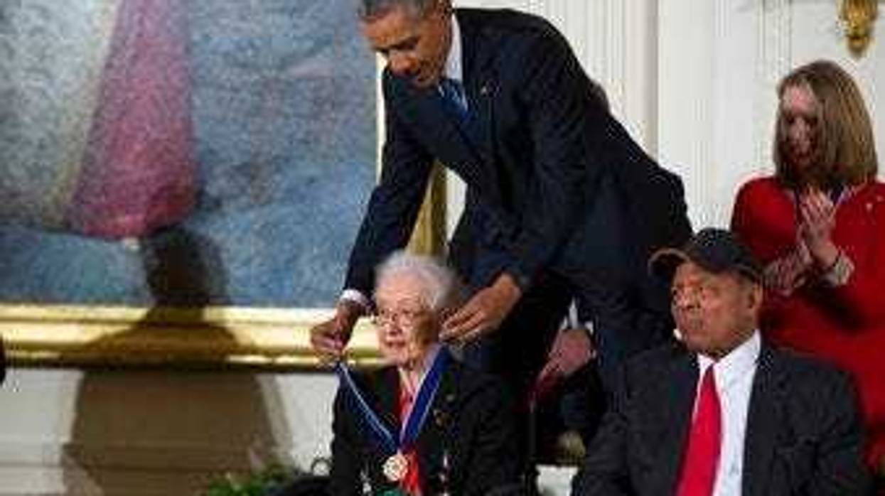 FILE - In this Nov. 24, 2015 photo, Willie Mays, right, looks on as President Barack Obama presents the Presidential Medal of Freedom to NASA mathematician Katherine Johnson during a ceremony at the White House. (AP Photo/Evan Vucci, File)