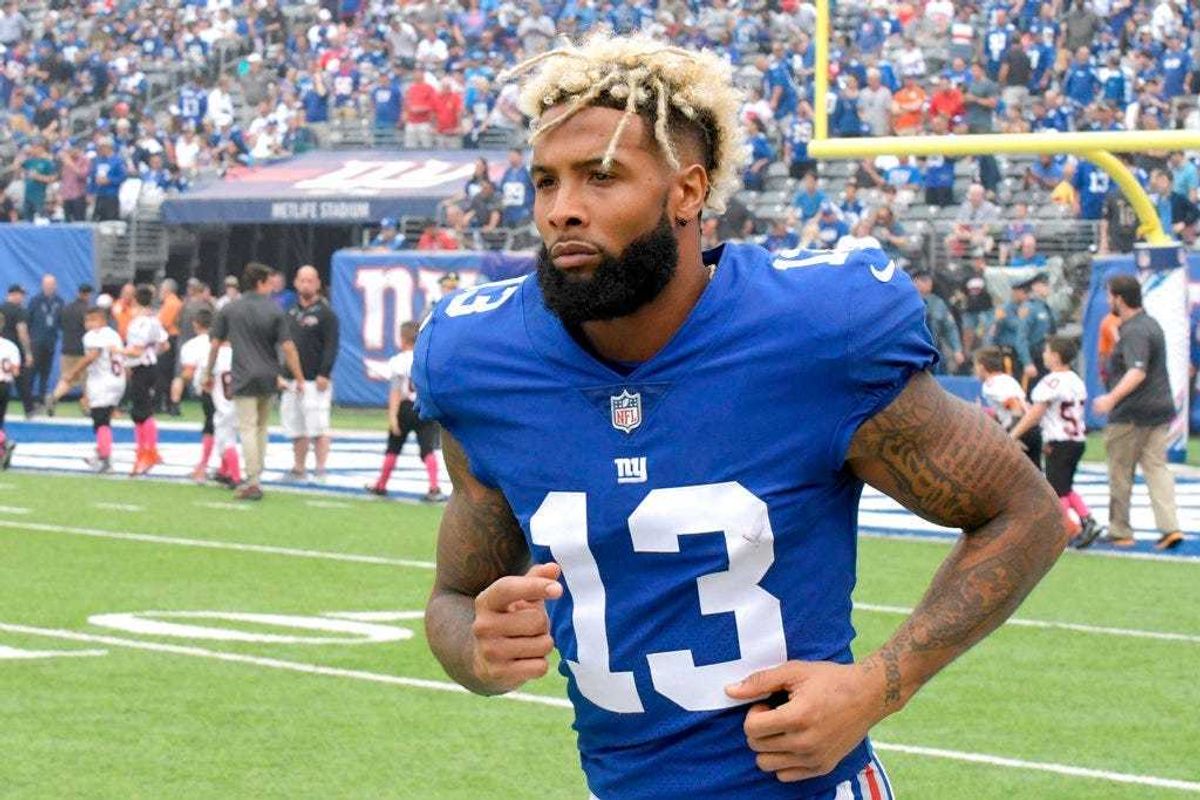 FILE - In this Oct. 8, 2017, file photo, New York Giants wide receiver Odell Beckham warms up prior to an NFL football game against the Los Angeles Chargers, in East Rutherford, N.J. The Giants have opened their first organized team activities under new c