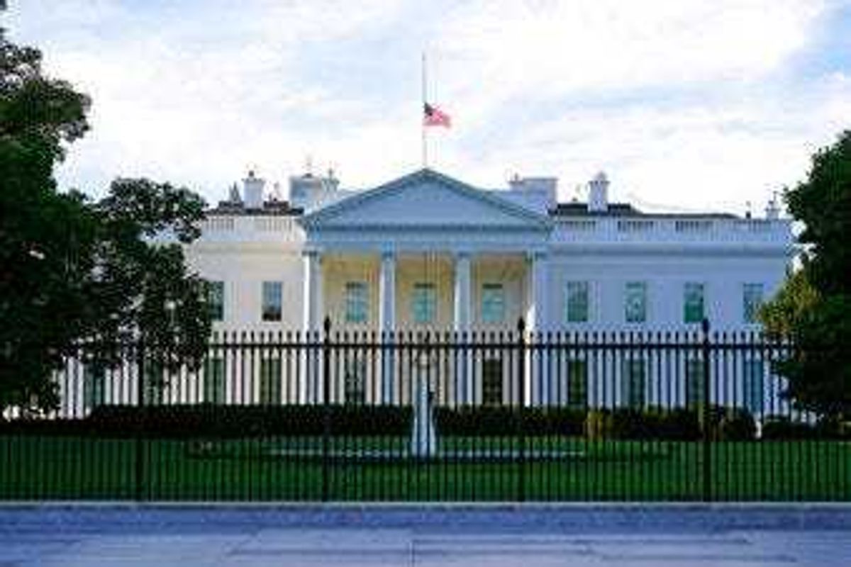 FILE - In this Saturday, Sept. 19, 2020, file photo, an American flag flies at half-staff over the White House in Washington. (AP Photo/Patrick Semansky, File)