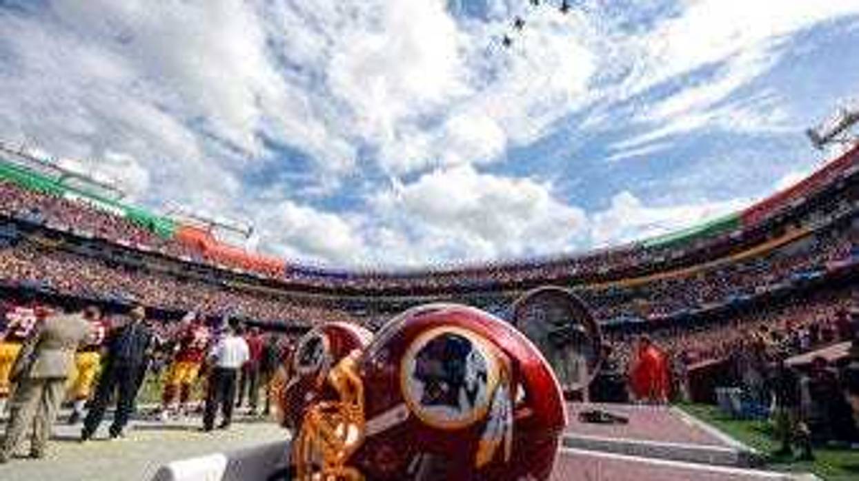 FILE - In this Sept. 18, 2016, file photo, F-26 fighter jets from the DC Air National Guard fly over FedEx Field before an NFL football game against between the Washington Redskins and the Dallas Cowboys in Landover, Md. (AP Photo/Nick Wass, File)