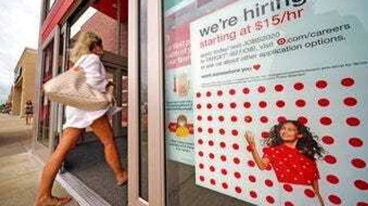 FILE - In this Sept. 2, 2020, file photo, a help wanted sign hangs on the door of a Target store in Uniontown, Pa. (AP Photo/Gene J. Puskar, File)