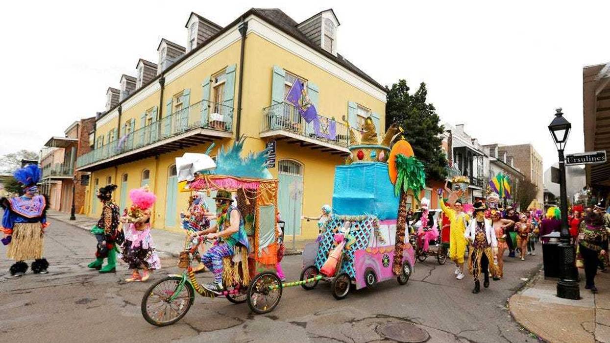 FILE - In this Tuesday, Feb. 25, 2020, file photo, Mondo Kayo parades down Chartres Street during Mardi Gras, in New Orleans. (AP Photo/Rusty Costanza, File)