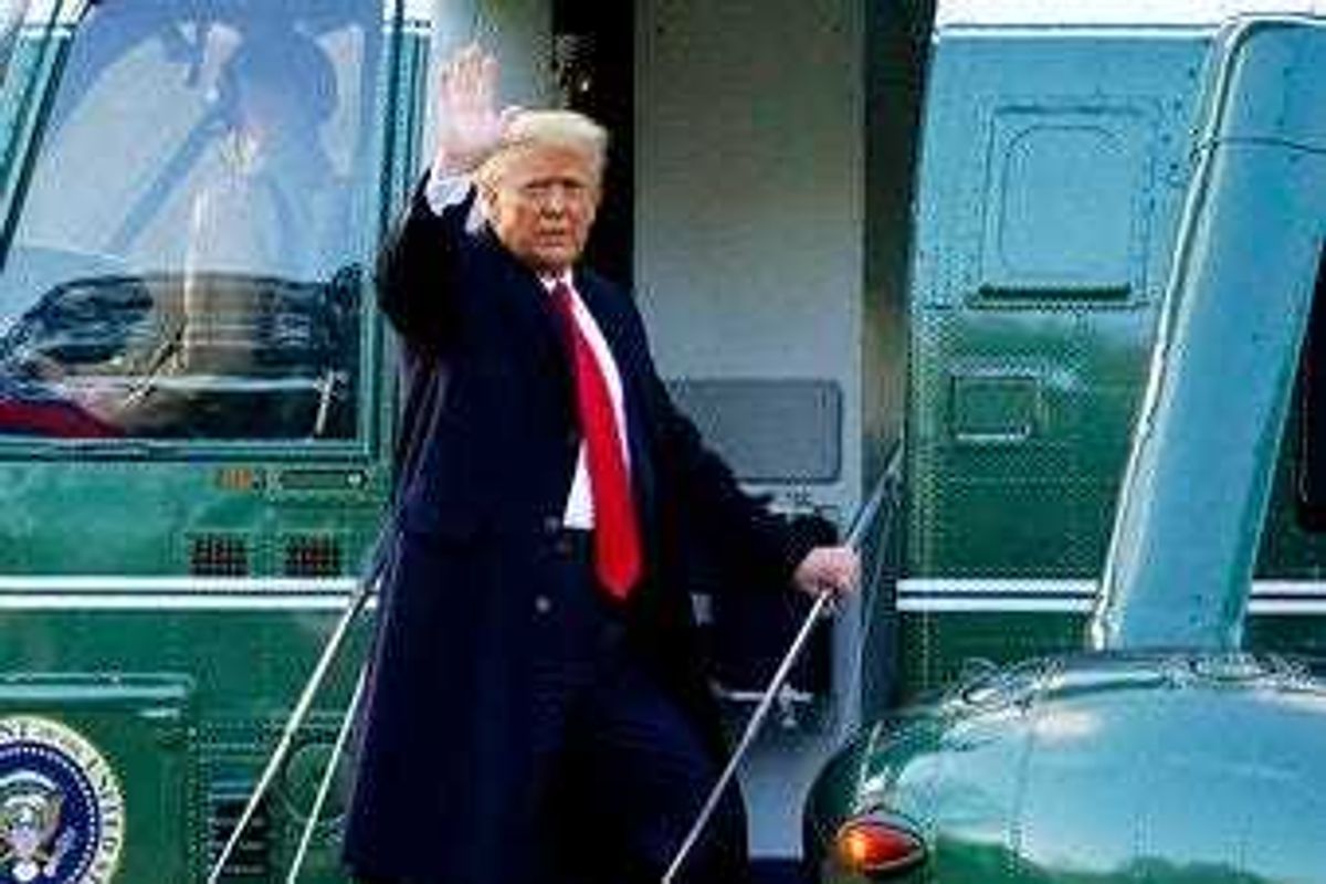 FILE - In this Wednesday, Jan. 20, 2021, file photo, President Donald Trump waves as he boards Marine One on the South Lawn of the White House, in Washington. (AP Photo/Alex Brandon, File)