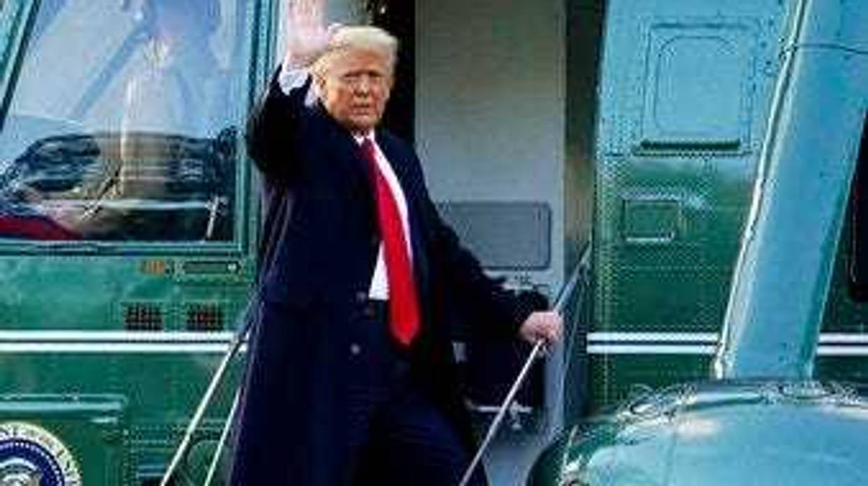 FILE - In this Wednesday, Jan. 20, 2021, file photo, President Donald Trump waves as he boards Marine One on the South Lawn of the White House, in Washington. (AP Photo/Alex Brandon, File)