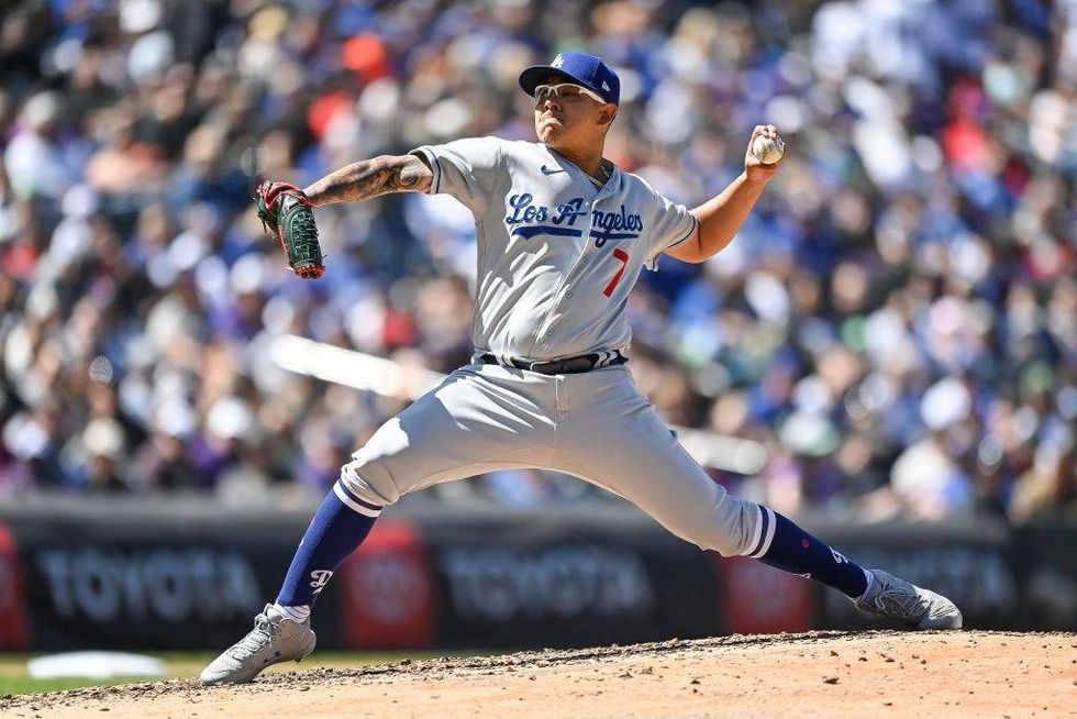 FILE - Julio Urias #7 of the Los Angeles Dodgers pitches against the Colorado Rockies in the second inning of a game at Coors Field on April 10, 2022 in Denver, Colorado.