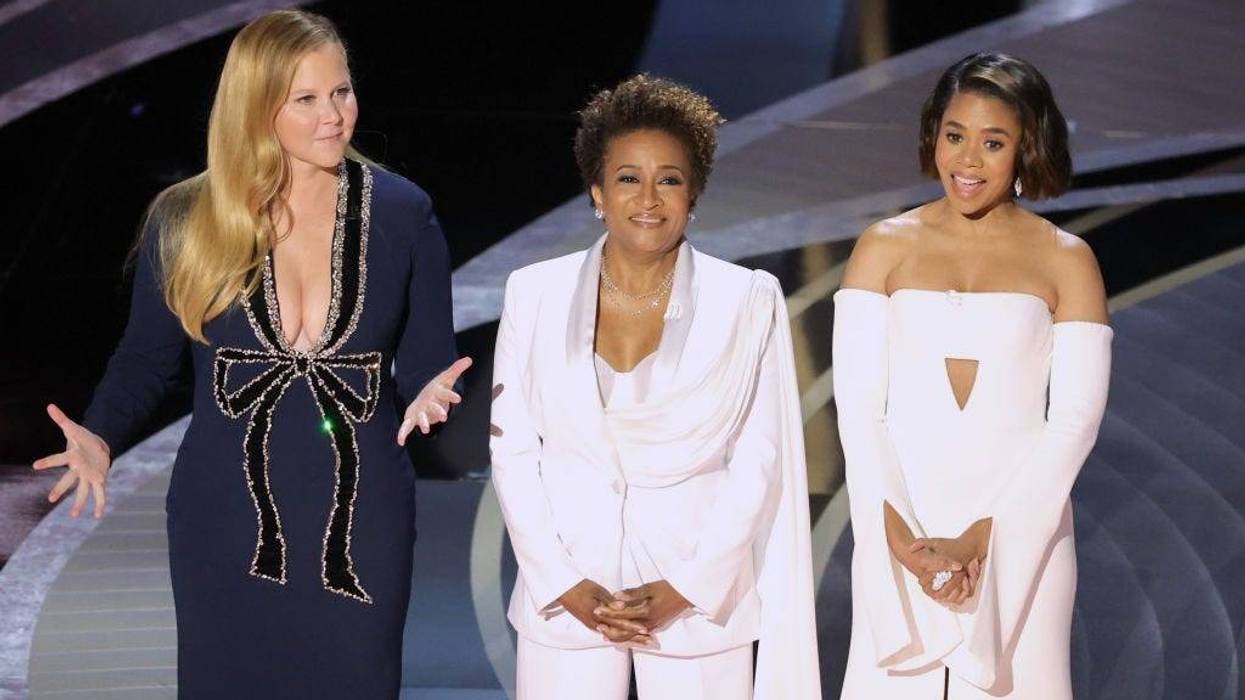 FILE - (L-R) Co-hosts Amy Schumer, Wanda Sykes, and Regina Hall speak onstage during the 94th Annual Academy Awards at Dolby Theatre on March 27, 2022 in Los Angeles.